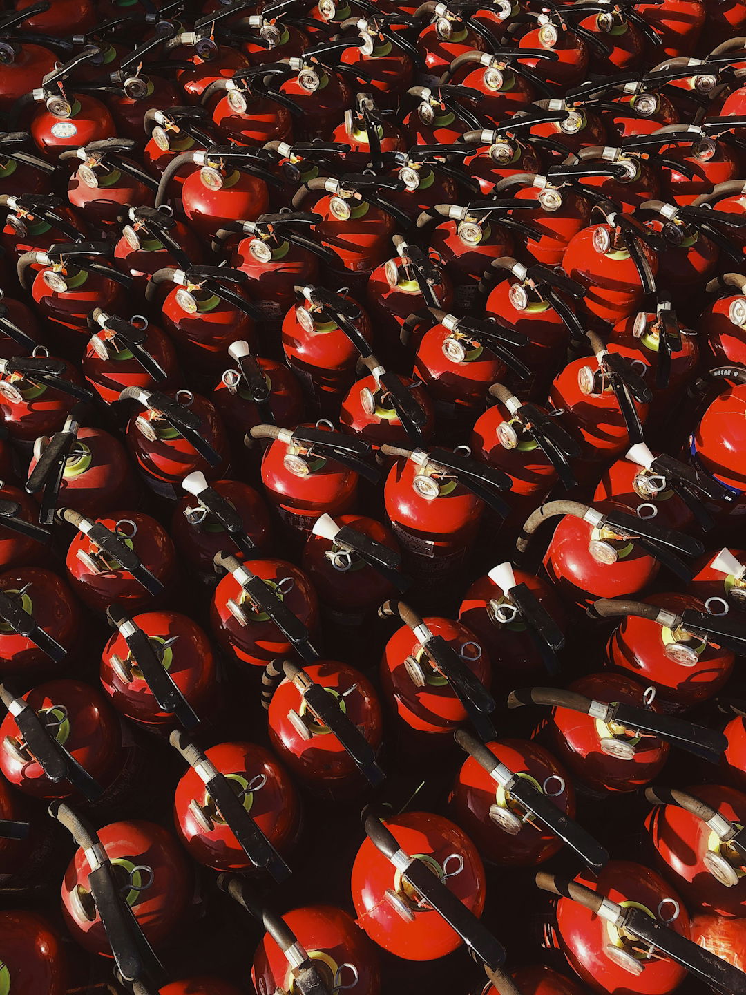 red-and-black-ceramic-mugs-on-black-steel-rack.jpg red and black ceramic mugs on black steel rack